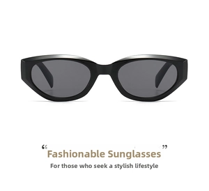 Macro shot of stylish black cat-eye sunglasses with thick glossy frames and dark lenses