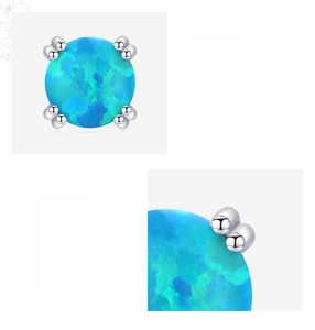 Close-up of S925 sterling silver opal stud earrings featuring four-prong settings