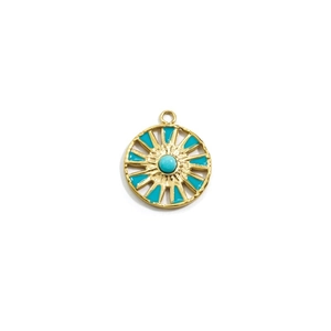 Close-up of a 14k gold stainless steel compass pendant with blue natural stone inlay