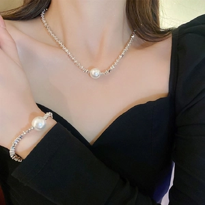 Irregular silver textured necklace and bracelet set with large round white pearls