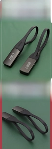 Detail of durable matte metal and black PE plastic keychain with flexible loop