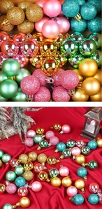 Close-up of matte, glossy, and glitter Christmas balls with festive props on red backdrop