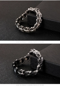 Detailed macro shot of vintage silver dragon scale texture on a men stainless steel bracelet