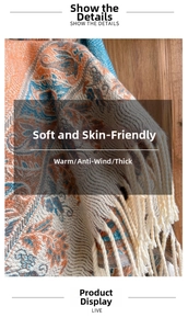 Macro detail of paisley patterned pashmina shawl featuring soft fringes on a wood surface