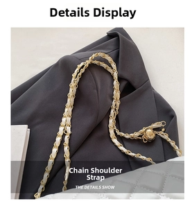 Detail of grey quilted bag with gold chain strap and adjustable flower ball slider