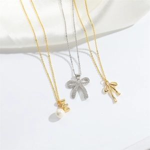 French vintage bow pendant necklaces in gold and silver with pearls and crystals