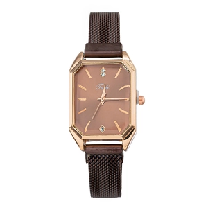 Detail of rose gold rectangular watch with brown dial and magnetic Milanese strap