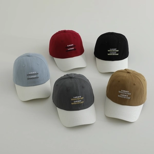 Five assorted colors of kids' lucky baseball caps with letter embroidery and contrast brims