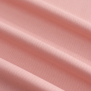 Makrodetail aus atmungsaktivem rosa Strickgewebe mit feiner Netzstruktur und weicher Bindung