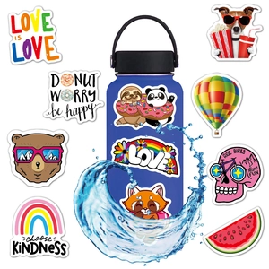 Waterproof VSCO vinyl stickers shown on a blue bottle with dynamic water splashes