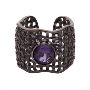 Macro shot of S925 silver ring featuring woven black texture and purple faceted gemstone