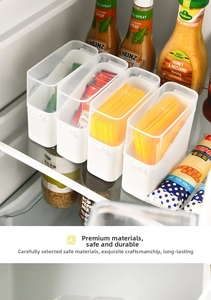 Stackable transparent cheese slice organizer box used for sorting sauces in a refrigerator