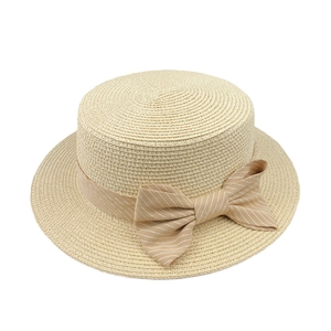 Elegant beige straw boater hat with a striped bow tie for summer sun protection