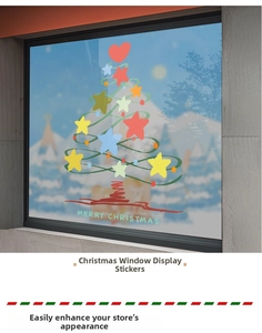 Close-up of hand-drawn Christmas tree window sticker with colorful stars and festive text