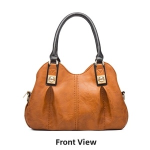Front view of a camel faux leather handbag with golden hardware and black handles