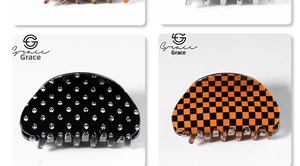 Detail of pumpkin-themed hair claw clips with black polka dot and orange checkerboard patterns
