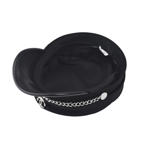 Close-up of black naval hat with silver chain and anchor badge detail for fashion headwear