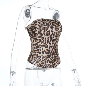 Detailed close-up of leopard print corset top with structured boning on white background