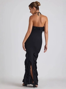 Robe longue noire élégante dos nu avec col licou, volants et fente latérale sexy