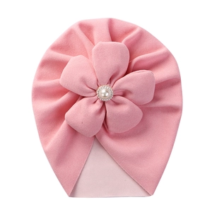 Detail of pink baby turban hat with large 3D flower, pearls and sparkling rhinestones
