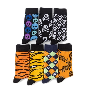 Detailed close-up of novelty cotton crew socks with skull, tiger stripe, and leopard patterns