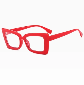 Detailed close-up of bright red square oversized fashion sunglasses with glossy finish