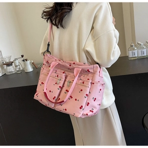 Pink cherry print tote bag featuring multiple pockets and large storage capacity