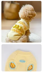 Detail view of pet sweater featuring 3D banana decor and knitted ribbed texture for dogs