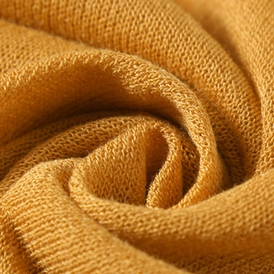 Macro shot of soft ginger knit fabric texture and premium cotton weave detail