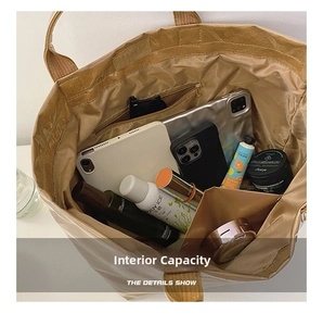 Interior view of brown Tyvek tote bag showing large capacity for tablet and cosmetics
