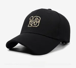 Close-up of black baseball cap with fine 10 ONWARD embroidery and breathable texture