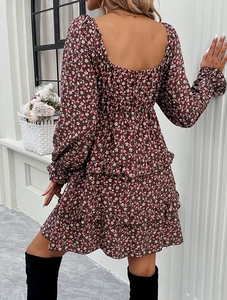 Detail showing back view of brown floral dress with square open back and ruffled hem