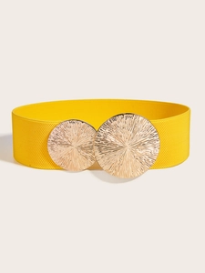 Detail of wide yellow elastic waist belt with double gold textured circular buckles