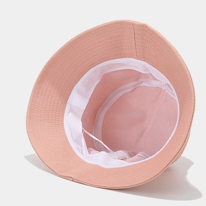 Pink cotton canvas bucket hat interior featuring white sweatband and adjustable drawstring