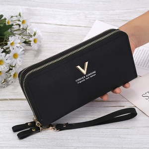 Women's black pebbled leather clutch wallet with dual zippers and gold V-logo detail