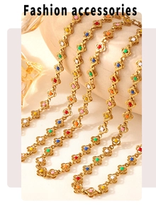 Detailed macro view of gold flower chain necklace with colorful enamel floral accents