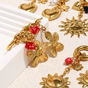 Gold plated stainless steel earring set with sun and flower charms and red heart details