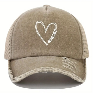 Detail view of khaki distressed mesh cap featuring printed heart and butterfly patterns