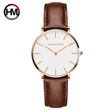 Close-up of Hannah Martin watch with white dial, rose gold case and brown leather strap