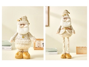 Detail of Christmas Santa gnome dolls in white and gold with telescopic legs for decor