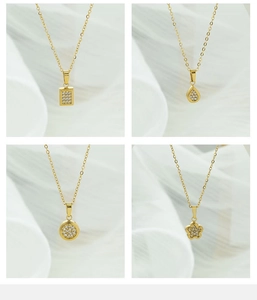 Close-up of four geometric titanium steel pendants with pavé set cubic zirconia