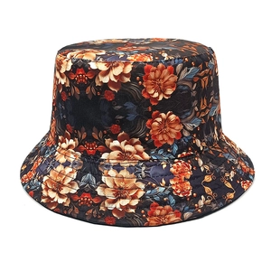 Detailed view of dark floral bucket hat with vibrant orange flower print and neat stitching