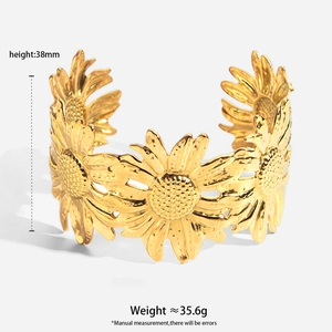 Detail of 38mm gold-plated stainless steel cuff bracelet with cutout sunflower motif
