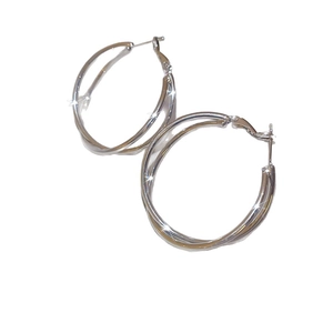 Elegant silver interlocking double hoop earrings with a polished shimmering finish