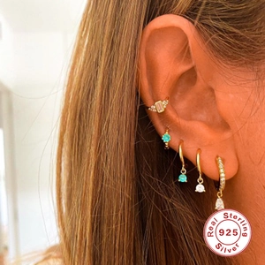 Close-up of S925 sterling silver hoop earrings set with multicolor zircon drop charms