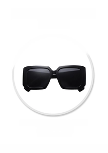 Close-up of oversized square black sunglasses frame featuring UV protection details