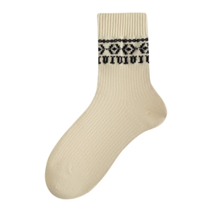 Beige crew socks with black Nordic geometric patterns and ribbed knit texture