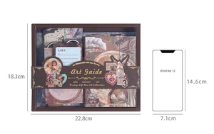 Vintage stationery gift box size comparison showing stickers and notes with iPhone 12 reference