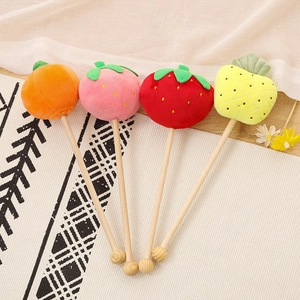 Plush fruit-shaped back massagers in strawberry orange pineapple on wooden sticks