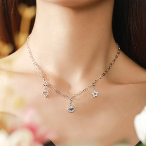 Elegant S925 sterling silver necklace featuring heart, evil eye, and star charm pendants